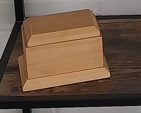 Pale wood pedestal-style pet urn